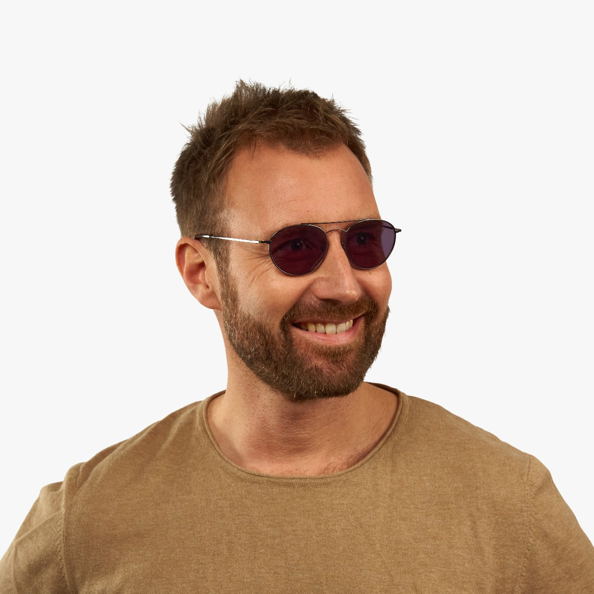 Person wearing Göteborg Gun sunglasses with purple lenses and metal frame