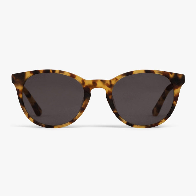 Tortoiseshell sunglasses with dark lenses