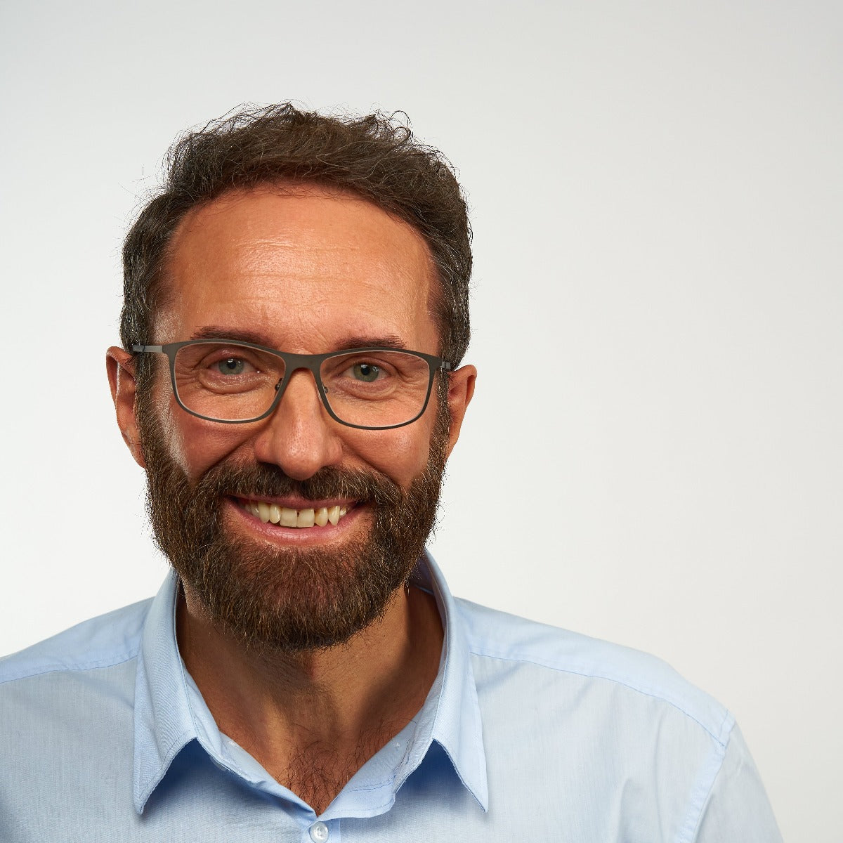 Person wearing Skagen Black rectangular glasses