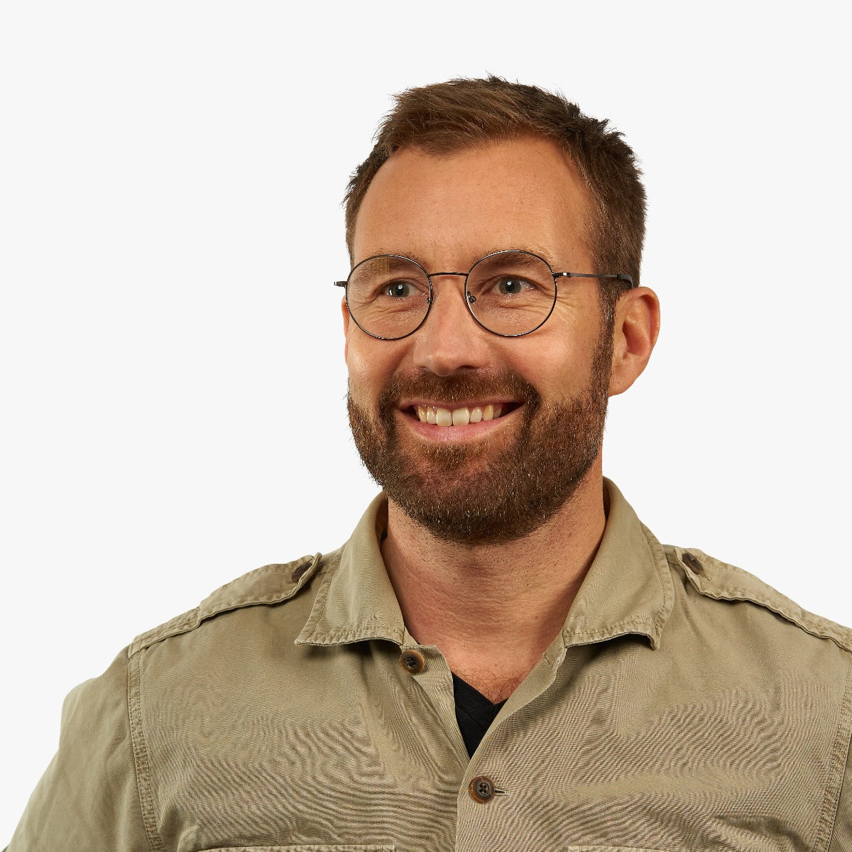 Person wearing round crystal reading glasses