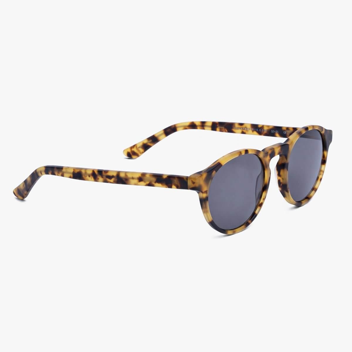 Tortoiseshell sunglasses with round frames and dark lenses