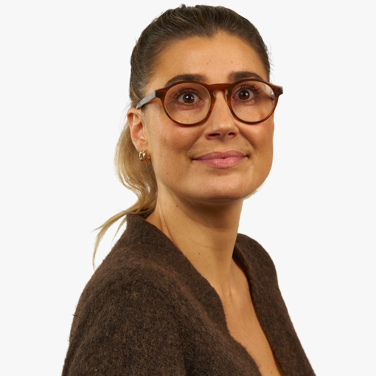 Person wearing Trondheim Shiny Walnut reading glasses
